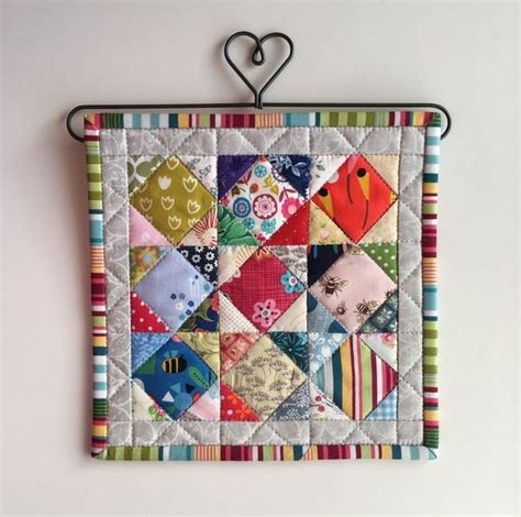 how to hang a small fabric quilt on metal wall|quilt hangers for mini quilts.